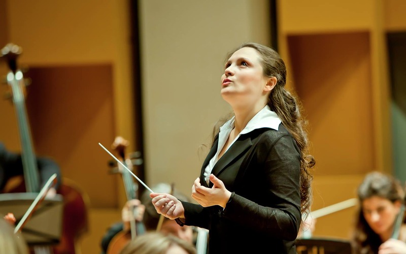 Dr. Silvia Tabor conducting in rehearsal